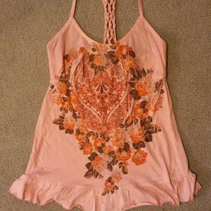 Peach colored top with flower pattern